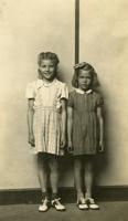 Thumbnail for Two standing sisters, …